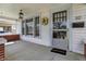 Inviting front porch with a 'welcome' mat, decorative wreath, and glass paneled door at 52 N Oakland Ave, Indianapolis, IN 46201