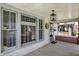 Charming front porch with decorative wreath and traditional lighting fixture at 52 N Oakland Ave, Indianapolis, IN 46201