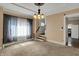 View of the living room boasting neutral colors, decorative ceilings, and stairway at 52 N Oakland Ave, Indianapolis, IN 46201
