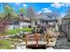 Charming backyard pond featuring a small wooden bridge and gazebo with a view of the home at 52 N Oakland Ave, Indianapolis, IN 46201