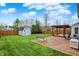 Backyard featuring brick patio, pergola, bench, and shed with a well-manicured lawn at 5223 Jerry Ct, Indianapolis, IN 46254