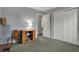 Bedroom showcasing ample space, closet, neutral walls, and decorative shelving at 5223 Jerry Ct, Indianapolis, IN 46254