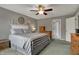 Cozy bedroom with a ceiling fan and natural wood accents at 5223 Jerry Ct, Indianapolis, IN 46254