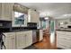 Kitchen showcasing black countertops, stainless steel appliances, and natural light at 5223 Jerry Ct, Indianapolis, IN 46254