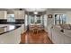 Eat-in kitchen with natural wood table, chairs, and decoratively valanced window at 5223 Jerry Ct, Indianapolis, IN 46254