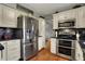 Well-equipped kitchen with stainless steel appliances, white cabinets, and functional design at 5223 Jerry Ct, Indianapolis, IN 46254