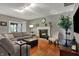 Bright living room with comfortable sectional sofa, fireplace, and sleek modern decor at 5223 Jerry Ct, Indianapolis, IN 46254