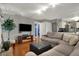 Living room with ample seating, fireplace, and access to the kitchen at 5223 Jerry Ct, Indianapolis, IN 46254