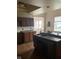 A kitchen area in need of renovation. Showing old cabinets, floors, and countertops at 601 E Thompson St, Edinburgh, IN 46124