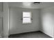Cozy bedroom with carpeted floors and a window providing natural light at 608 N Gray St, Indianapolis, IN 46201