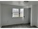 Bedroom offering plush carpet, modern baseboards and trim and a view of the outdoors through the windows at 608 N Gray St, Indianapolis, IN 46201