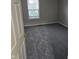 Bedroom with carpet floors and a window at 6120 Salanie Pl, Indianapolis, IN 46254