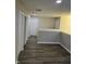 Hallway with modern dark wood flooring and fresh paint at 6120 Salanie Pl, Indianapolis, IN 46254