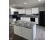 Modern kitchen features white cabinets, granite counters, and stainless steel appliances at 6120 Salanie Pl, Indianapolis, IN 46254