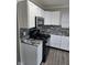 This well-equipped kitchen offers sleek appliances and a stylish gray backsplash design at 6120 Salanie Pl, Indianapolis, IN 46254