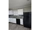 Modern kitchen features white cabinets, granite counters, and stainless steel appliances at 6120 Salanie Pl, Indianapolis, IN 46254
