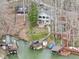 Breathtaking aerial view of the lakefront property, featuring a charming home and boat docks at 6599 Meadowlark Dr, Nineveh, IN 46164