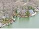 Scenic aerial shot showcases lakefront homes with boat docks nestled among lush trees at 6599 Meadowlark Dr, Nineveh, IN 46164