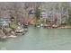 Aerial view of waterfront homes with docks, capturing the essence of lakeside living and recreational opportunities at 6599 Meadowlark Dr, Nineveh, IN 46164