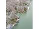 Breathtaking aerial shot of lakefront properties with docks, highlighting the serene and picturesque waterside living at 6599 Meadowlark Dr, Nineveh, IN 46164