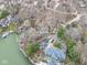 Aerial view of lakefront homes with boat docks, showcasing waterfront living and neighborhood layout at 6599 Meadowlark Dr, Nineveh, IN 46164