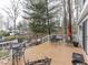 Inviting wooden deck featuring outdoor seating and beautiful views of the surrounding trees and lake at 6599 Meadowlark Dr, Nineveh, IN 46164