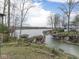 Backyard with views of the lake and nearby docks, with a small boat dock at 6599 Meadowlark Dr, Nineveh, IN 46164