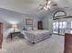 Cozy bedroom with vaulted ceiling, carpet and a sliding glass door leading to a deck at 6599 Meadowlark Dr, Nineveh, IN 46164