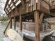Covered boat dock with boat, kayak, and storage space, providing secure and convenient access to the lake at 6599 Meadowlark Dr, Nineveh, IN 46164