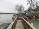 Spacious dock with lake views and multiple boat slips, offering a perfect spot for relaxation and water activities at 6599 Meadowlark Dr, Nineveh, IN 46164
