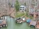 Scenic view of a lake house with a well-maintained dock and waterfront access, ideal for boating and relaxation at 6599 Meadowlark Dr, Nineveh, IN 46164