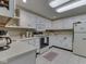 Bright kitchen features white cabinets and countertop space at 6599 Meadowlark Dr, Nineveh, IN 46164