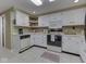 Bright kitchen features white cabinets and countertop space at 6599 Meadowlark Dr, Nineveh, IN 46164