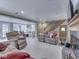 Expansive living area with fireplace, sunroom access, and comfortable tan seating at 6599 Meadowlark Dr, Nineveh, IN 46164