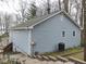 Exterior view of a home showing a side elevation with an outdoor air conditioning unit and staircase at 6599 Meadowlark Dr, Nineveh, IN 46164