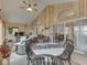Spacious sunroom offers a cozy dining area, comfortable seating and picturesque waterfront views at 6599 Meadowlark Dr, Nineveh, IN 46164
