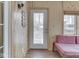 Cozy sunroom features natural wood paneling, large windows and a quaint daybed seating area at 6599 Meadowlark Dr, Nineveh, IN 46164