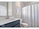 Bathroom showcasing a navy vanity, white countertop, and a glass-enclosed shower at 7012 Pickett Pl, Carmel, IN 46033