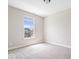 Bright bedroom featuring soft carpet, neutral walls, and a window with natural light at 7012 Pickett Pl, Carmel, IN 46033