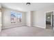 Bedroom with carpet, natural light, neutral walls, and door leading to ensuite bath at 7012 Pickett Pl, Carmel, IN 46033
