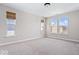 Bright bedroom with natural light, carpet, and window blinds at 7012 Pickett Pl, Carmel, IN 46033