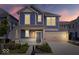 Charming two-story home with blue siding, a covered porch, and a well-manicured lawn at 7012 Pickett Pl, Carmel, IN 46033