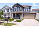 Attractive home with a covered front porch, a two-car garage, and curb appeal at 7012 Pickett Pl, Carmel, IN 46033