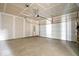 Spacious garage with concrete floor, drywall, and insulated white garage door at 7012 Pickett Pl, Carmel, IN 46033