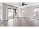 Bright, open living room with wood floors, large sliding glass doors, and neutral paint at 7012 Pickett Pl, Carmel, IN 46033