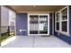 Covered patio featuring blue siding, sliding glass doors, and a privacy fence at 7012 Pickett Pl, Carmel, IN 46033