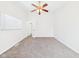 Serene bedroom with plush carpeting, ceiling fan, and ample natural light at 709 S A St, Elwood, IN 46036