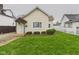 Inviting single-story home with a green lawn and classic white picket fence at 709 S A St, Elwood, IN 46036