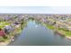 Beautiful aerial view of a lake community with lush landscaping and well-maintained homes at 7371 Windridge Way, Brownsburg, IN 46112