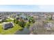Aerial view of the home surrounded by mature trees and beautiful landscaping with waterfront views at 7371 Windridge Way, Brownsburg, IN 46112